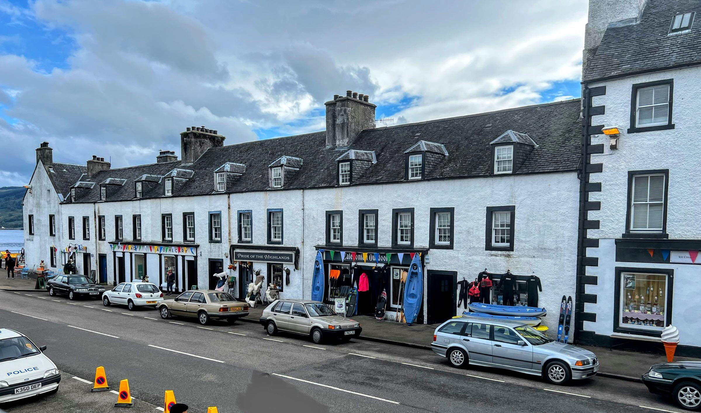 The high street has been transformed with signage for 'Loch Henry' and colourful bunting. 