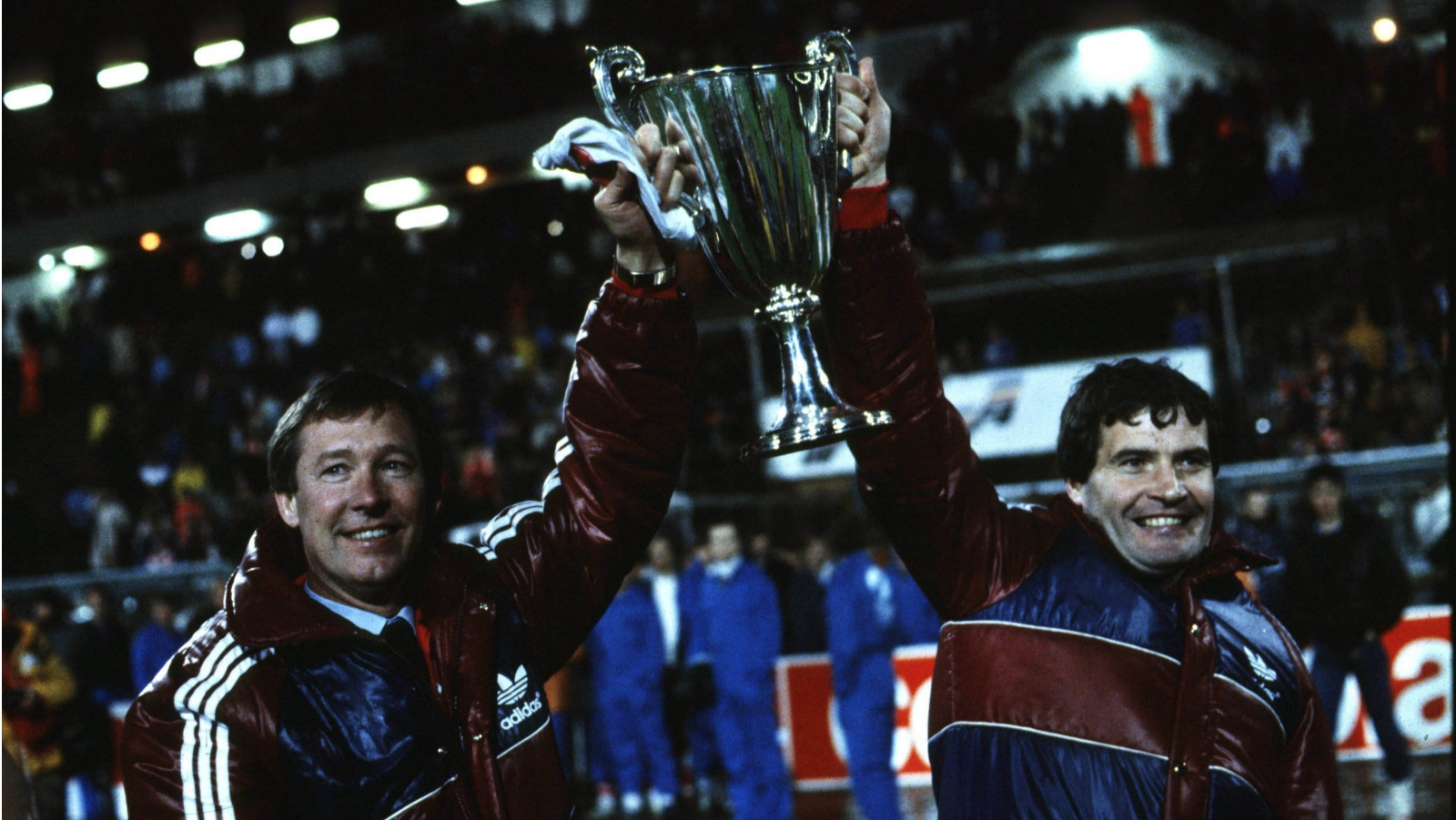 Alex Ferguson and assistant Archie Knox hold the trophy aloft.