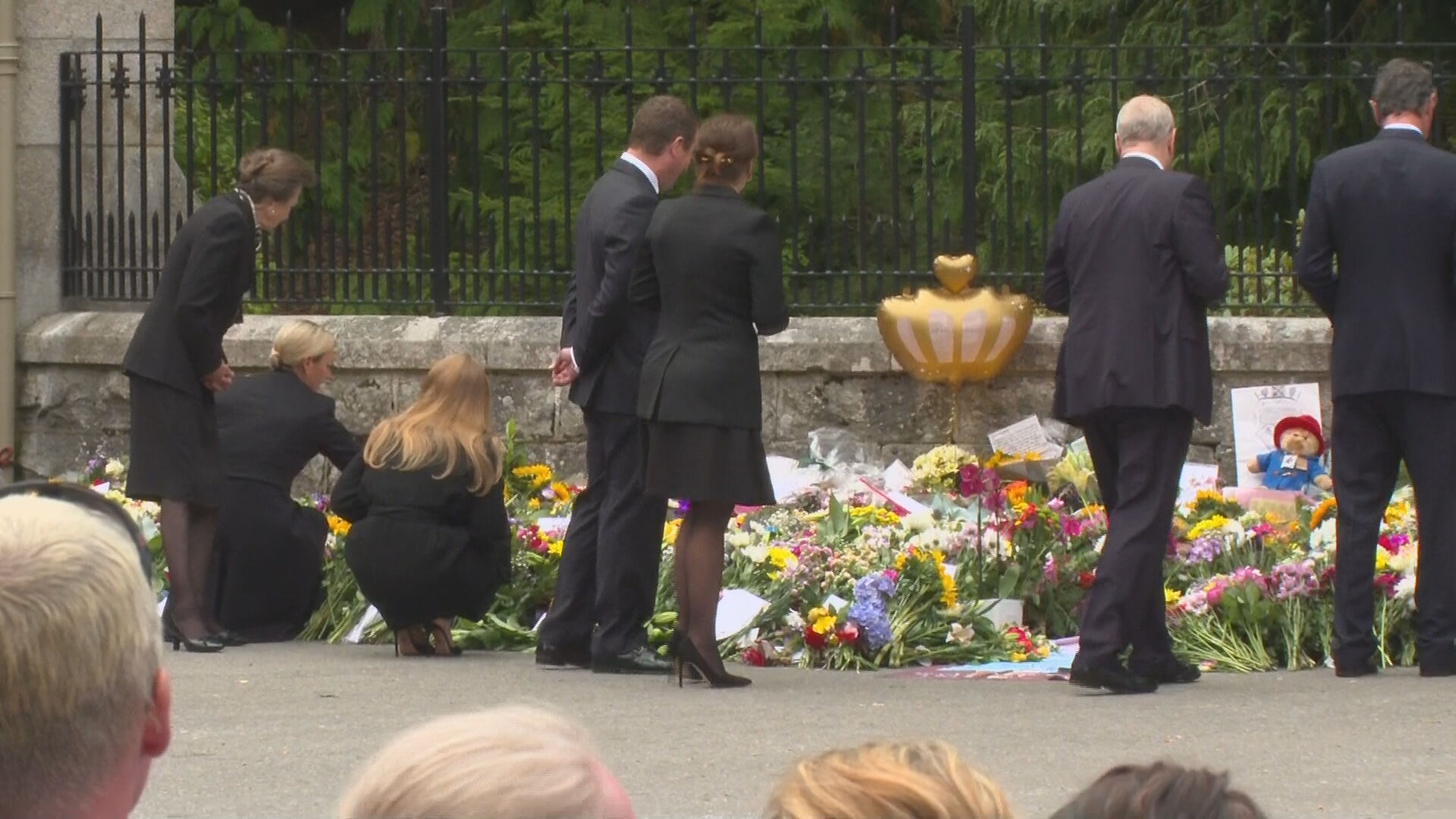 Some members of the family laid their own tributes outside the gates. (Image: ITN)