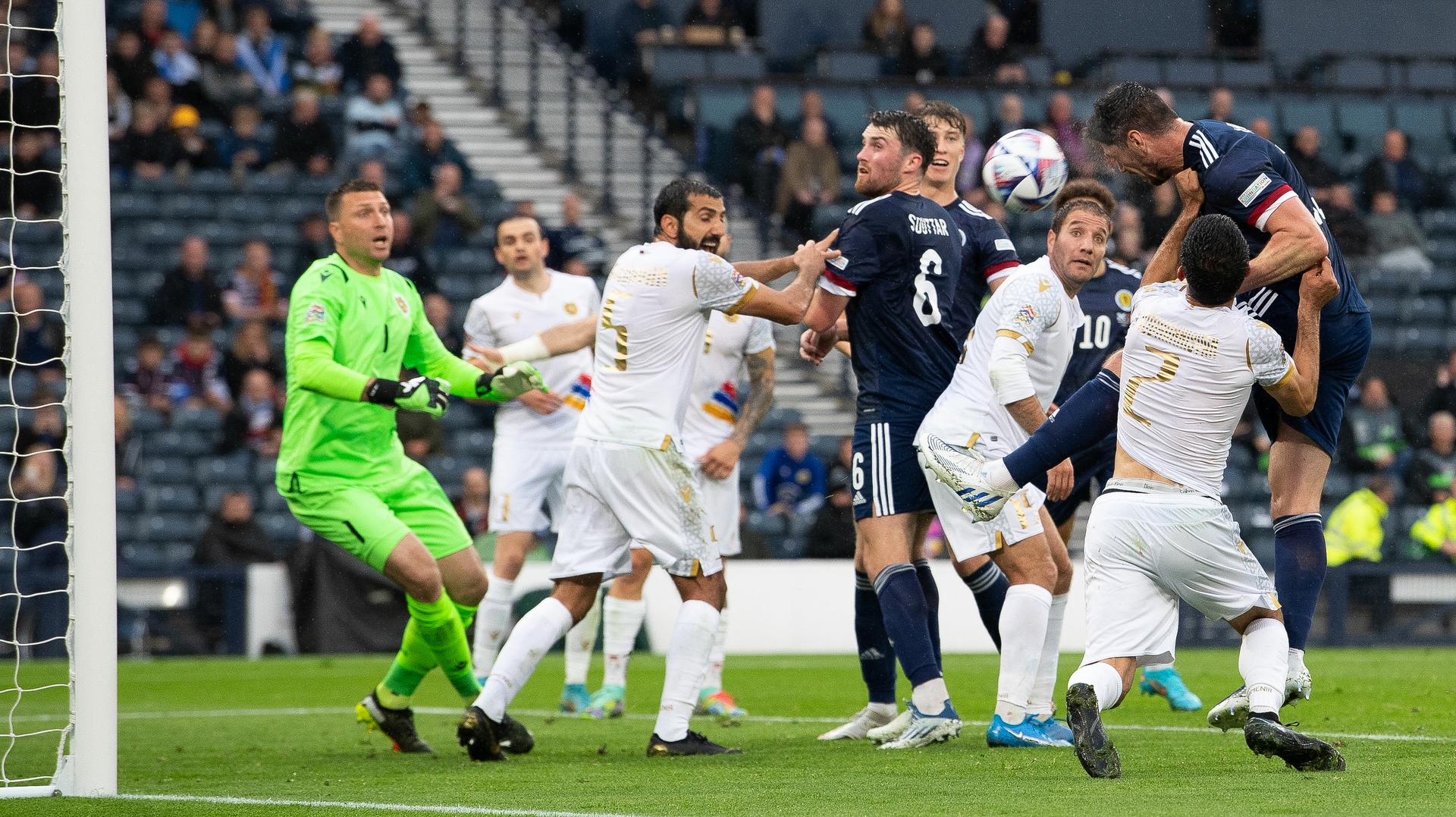 Scott McKenna heads the second goal of the night as Scotland ease to victory.