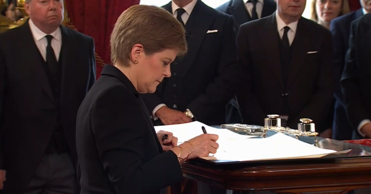First Minister Nicola Sturgeon signs oath.