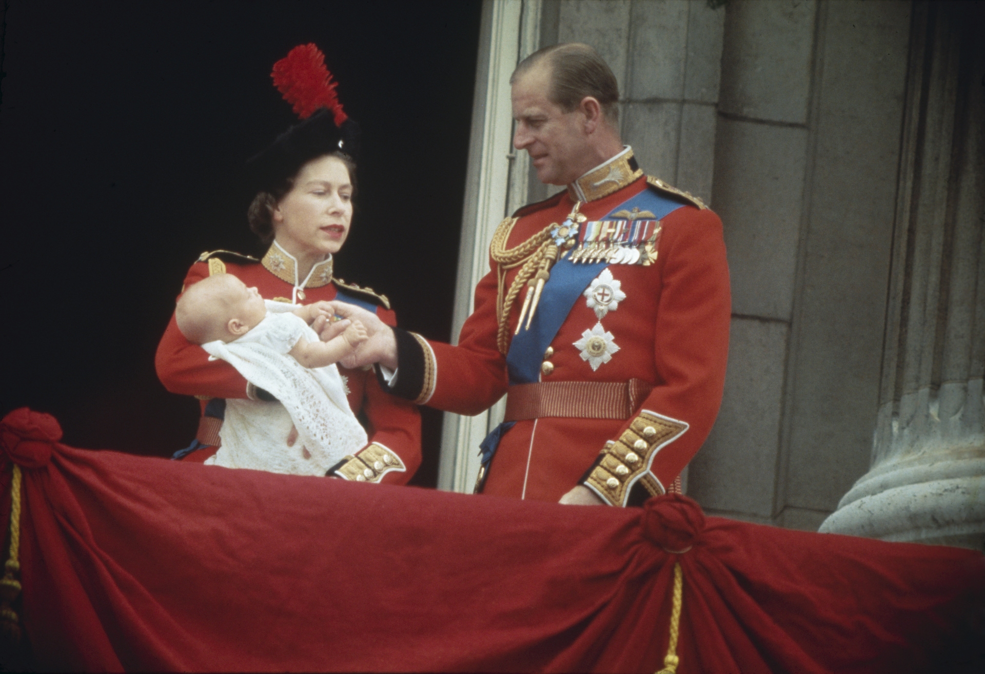 Queen Elizabeth II and Prince Philip with their baby son, Prince Edward on the balcony at Buckingham Palace, during the Trooping of the Colour, London, 13th June 1964. 
