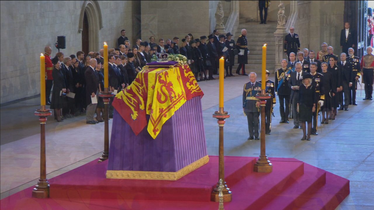 The Queen's coffin is seen lying in state at Westminster Hall, draped with the Royal Standard