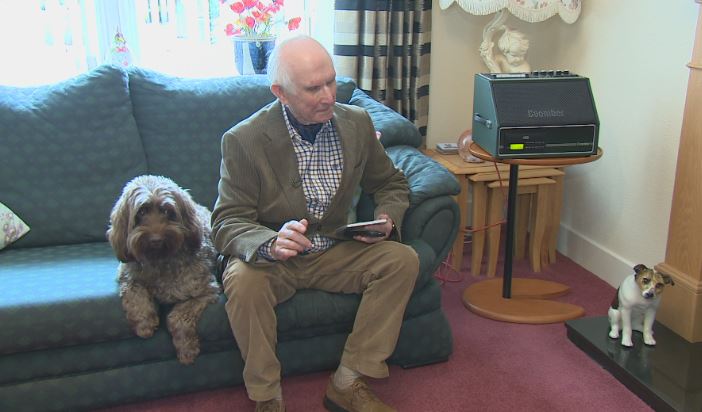 Sandy Ingram enjoys the song he penned for the Queen alongside his dog, Spencer.