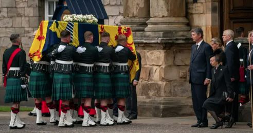 The Princess Royal curtseying as the Queen’s coffin arrives at Holyroodhouse.
