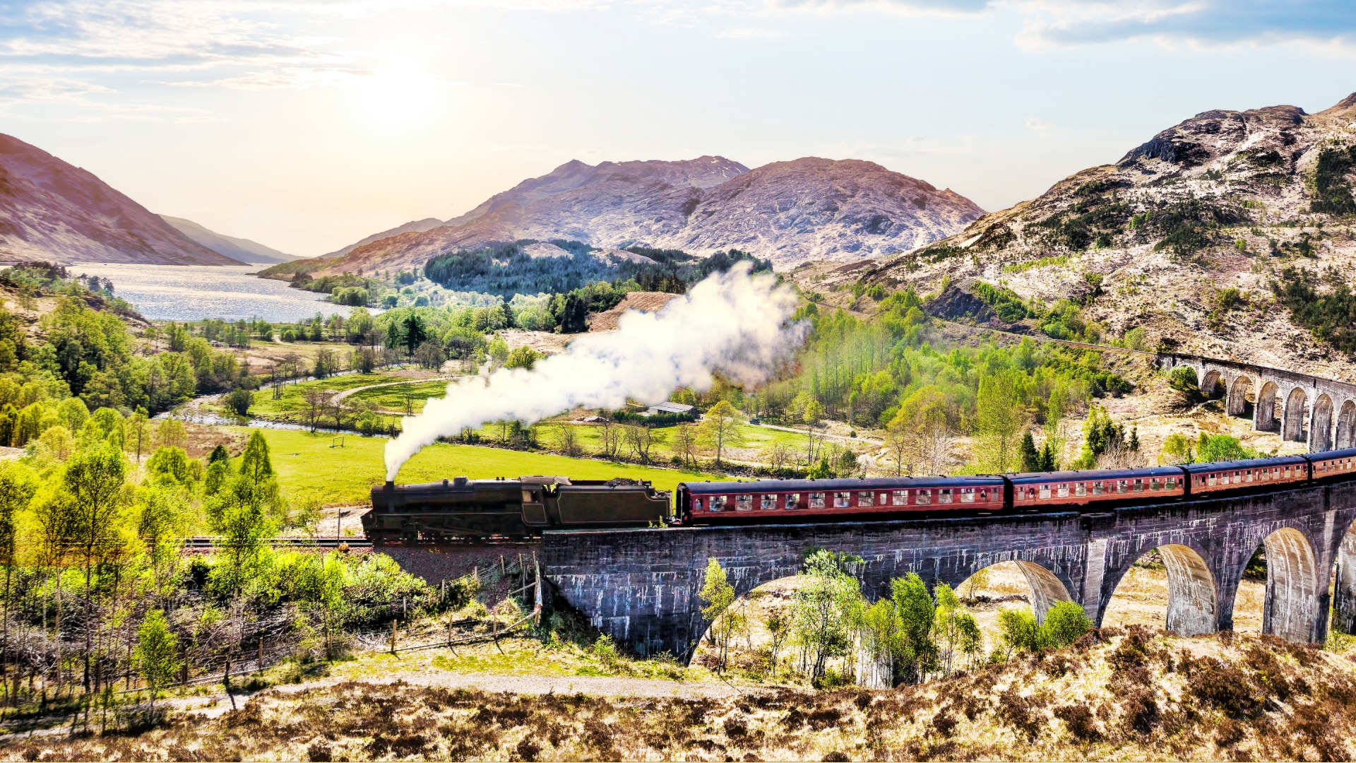  The Jacobite steam train running over the Glenfinnan Railway Viaduct.