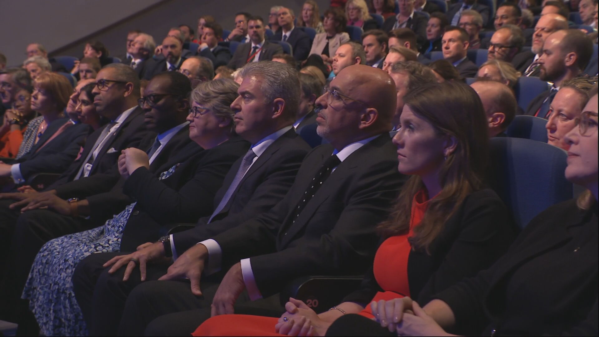 Tory members listen to their new leader's speech.