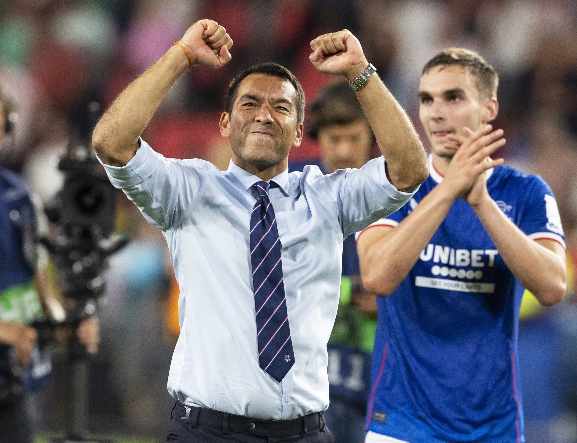 Van Bronckhorst celebrates Champions League Play-Off win over PSV. (Photo by Alan Harvey / SNS Group)