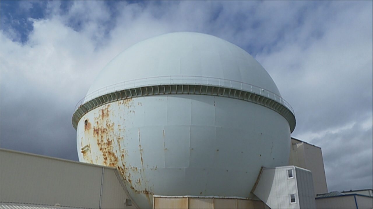 Part of the former nuclear plant is seen, taking the shape of a large white ball