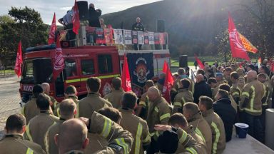 Hundreds of firefighters protest against ‘insulting’ pay offer outside Scottish Parliament