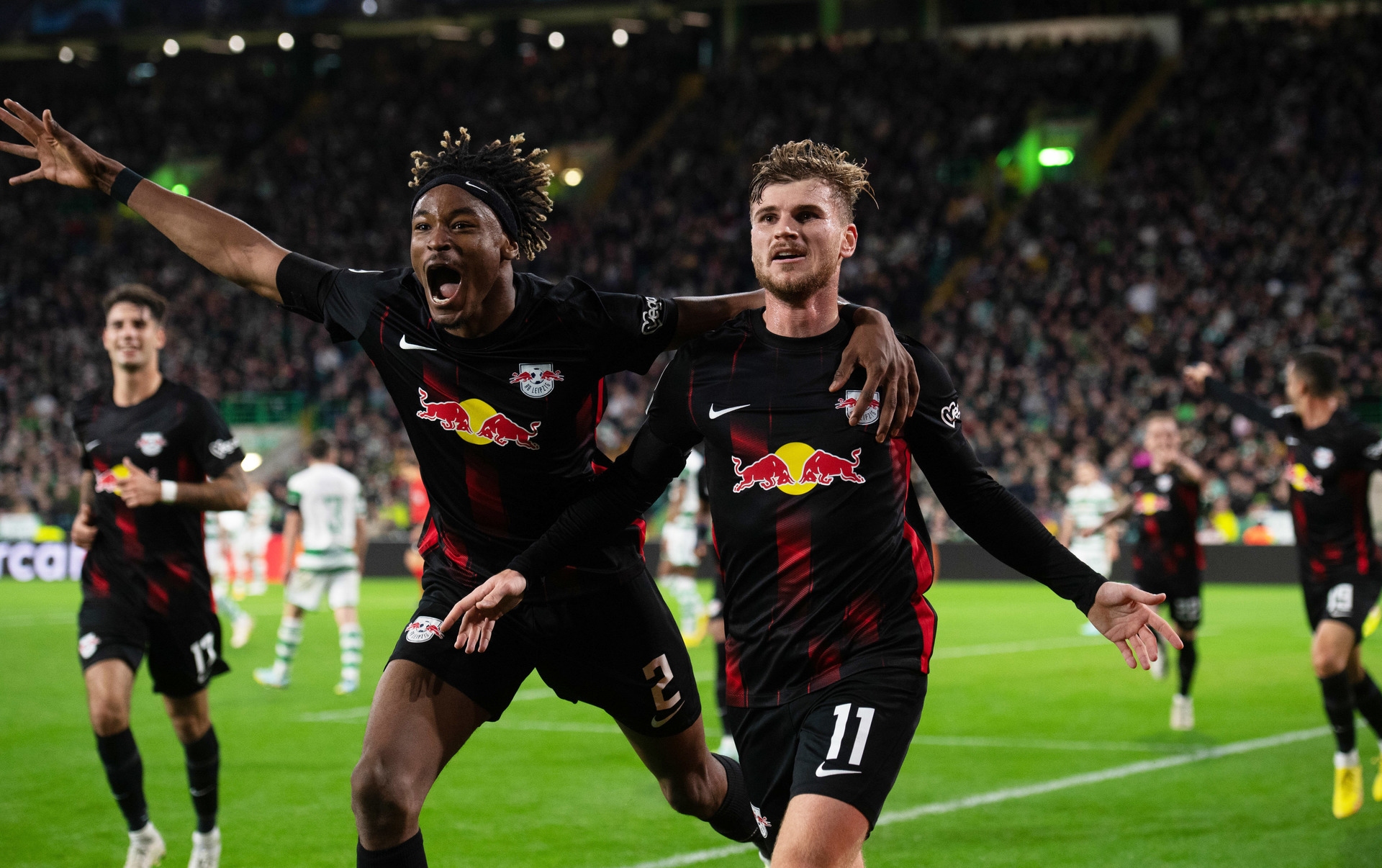 Leipzig celebrate 2-0 win at Celtic Park.