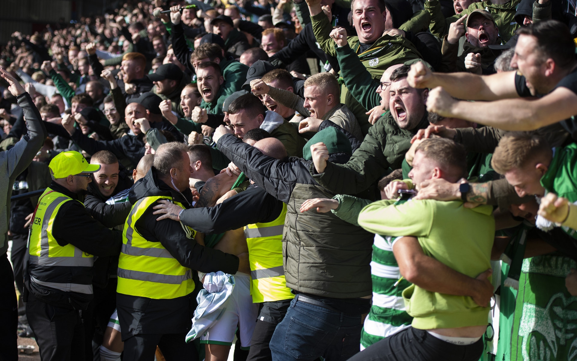 Celtic players ran to the fans to celebrate the winning goal. 
