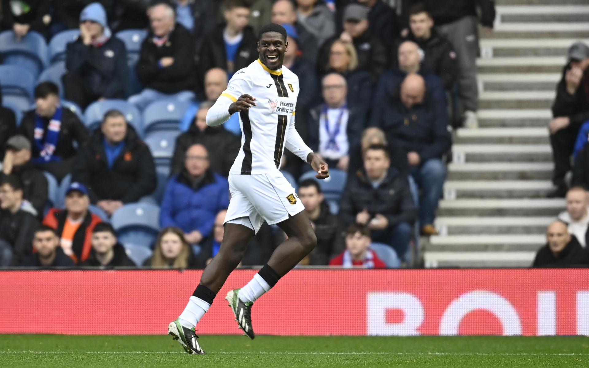 Joel  Nouble celebrates making it 1-0 at Ibrox.