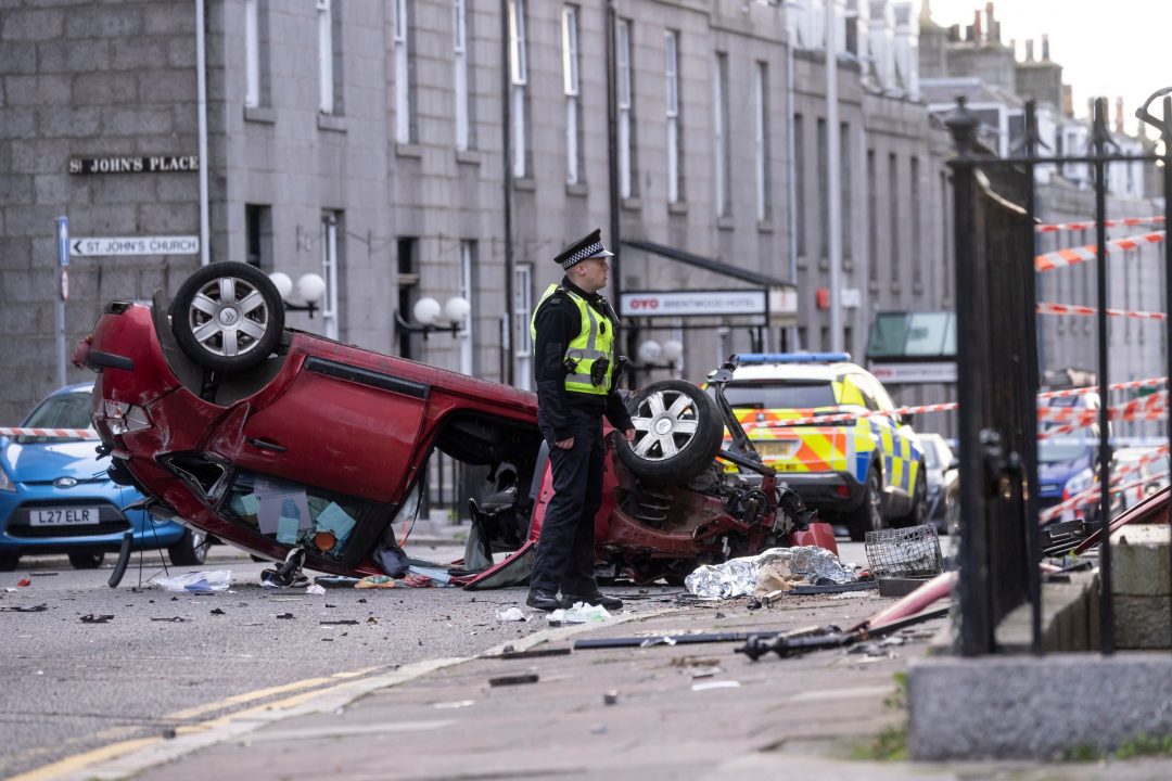 Man charged over Aberdeen car crash after police chase that left vehicle on roof and woman in hospital