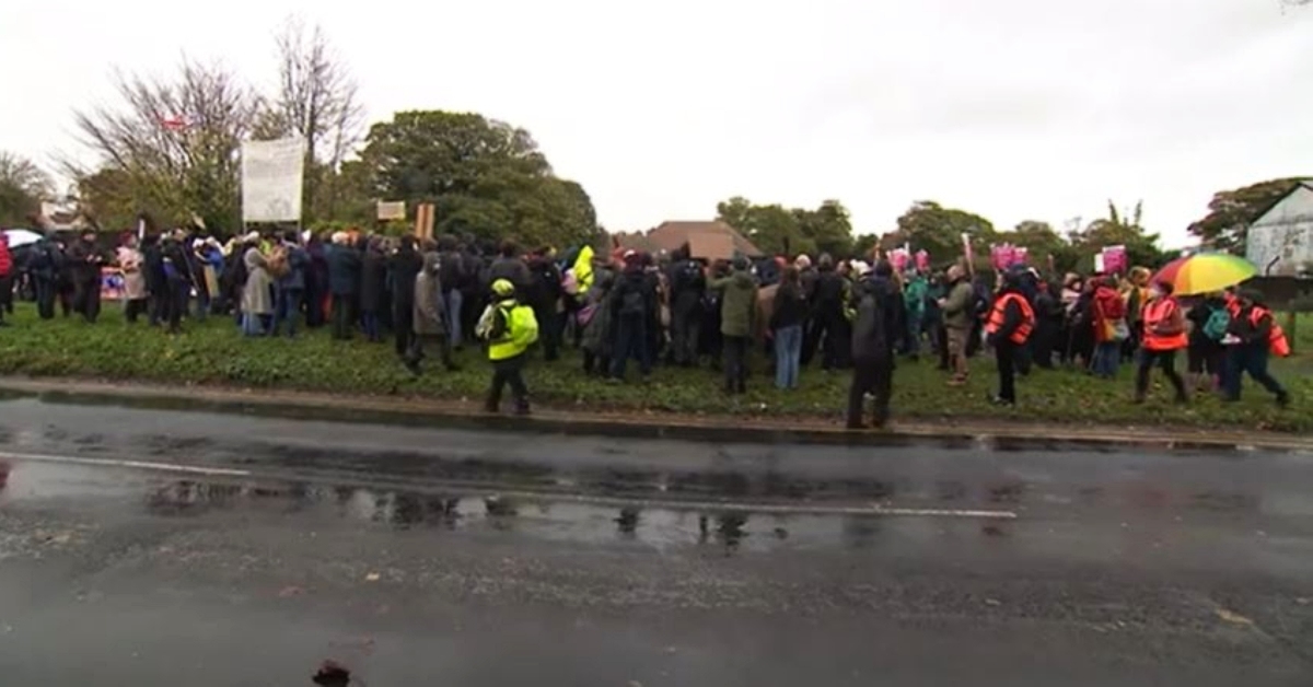 Hundreds protest outside migrant centre amid concerns over conditions