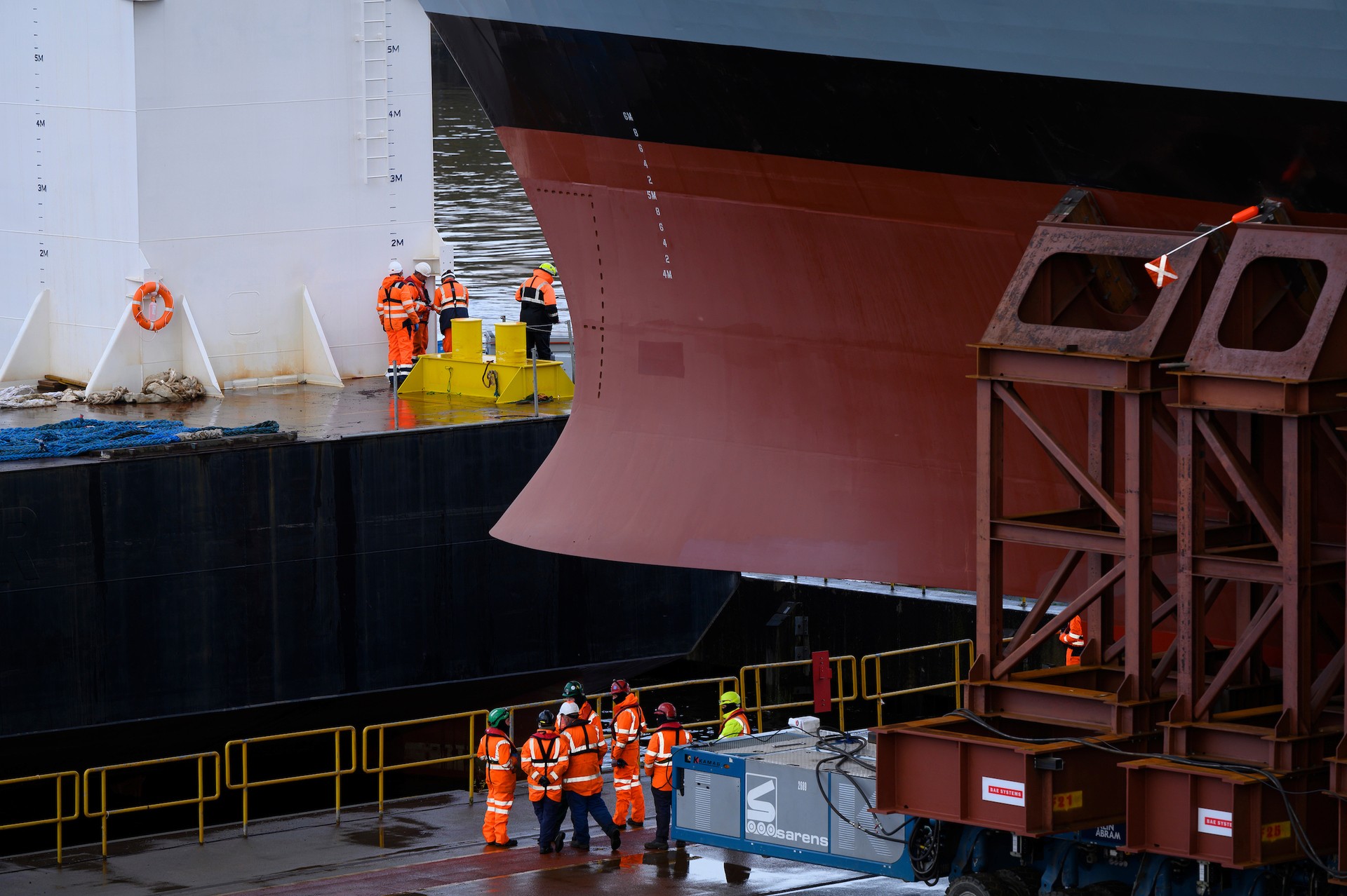 Barge is moved into position for HMS Glasgow