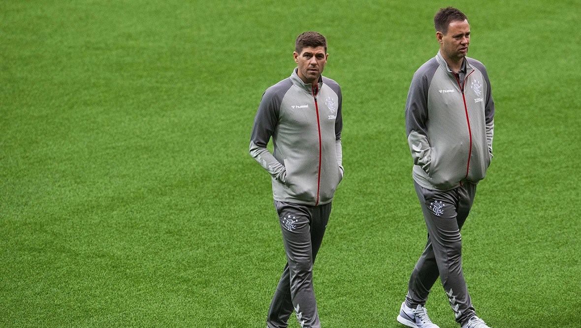 Michael Beale walking alongside Steven Gerrard in Bern, Switzerland.