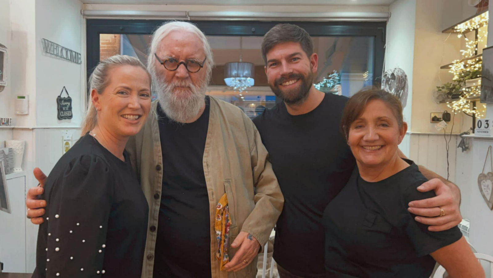 Billy Connolly with staff at a Milngavie coffee shop earlier this month. 