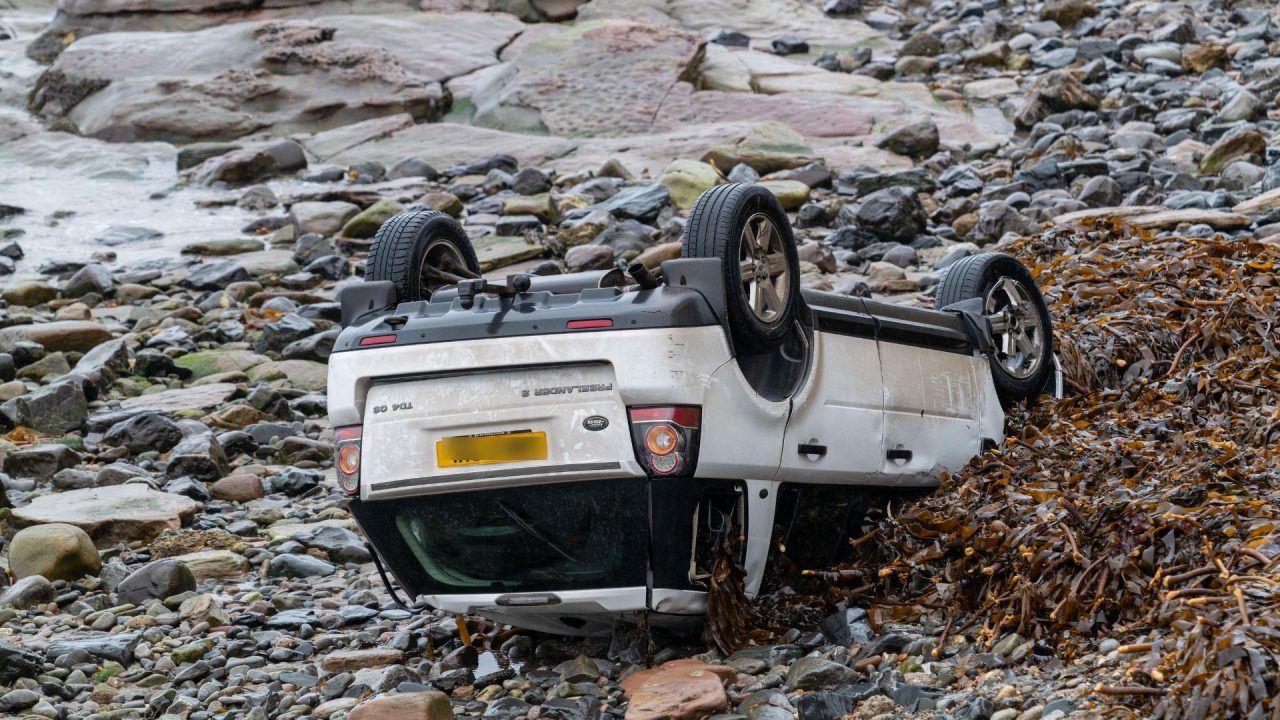 Woman charged after car lands on roof on shore at Gardenstown in Aberdeenshire