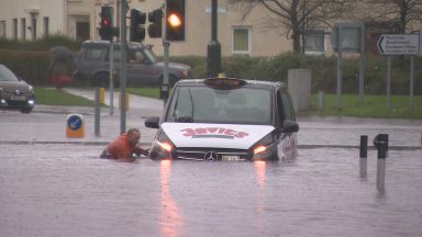 Cars float off and people stranded in homes by flooding in Scotland as record breaking rain brings chaos
