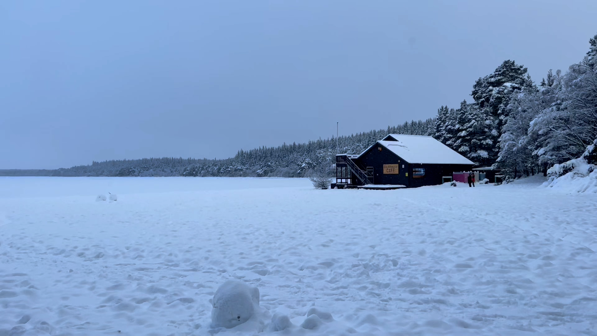 Cabin amid the snowscape in Aviemore.