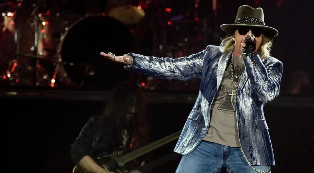 Axl Rose vows to stop throwing mic into the crowd after fan injured
