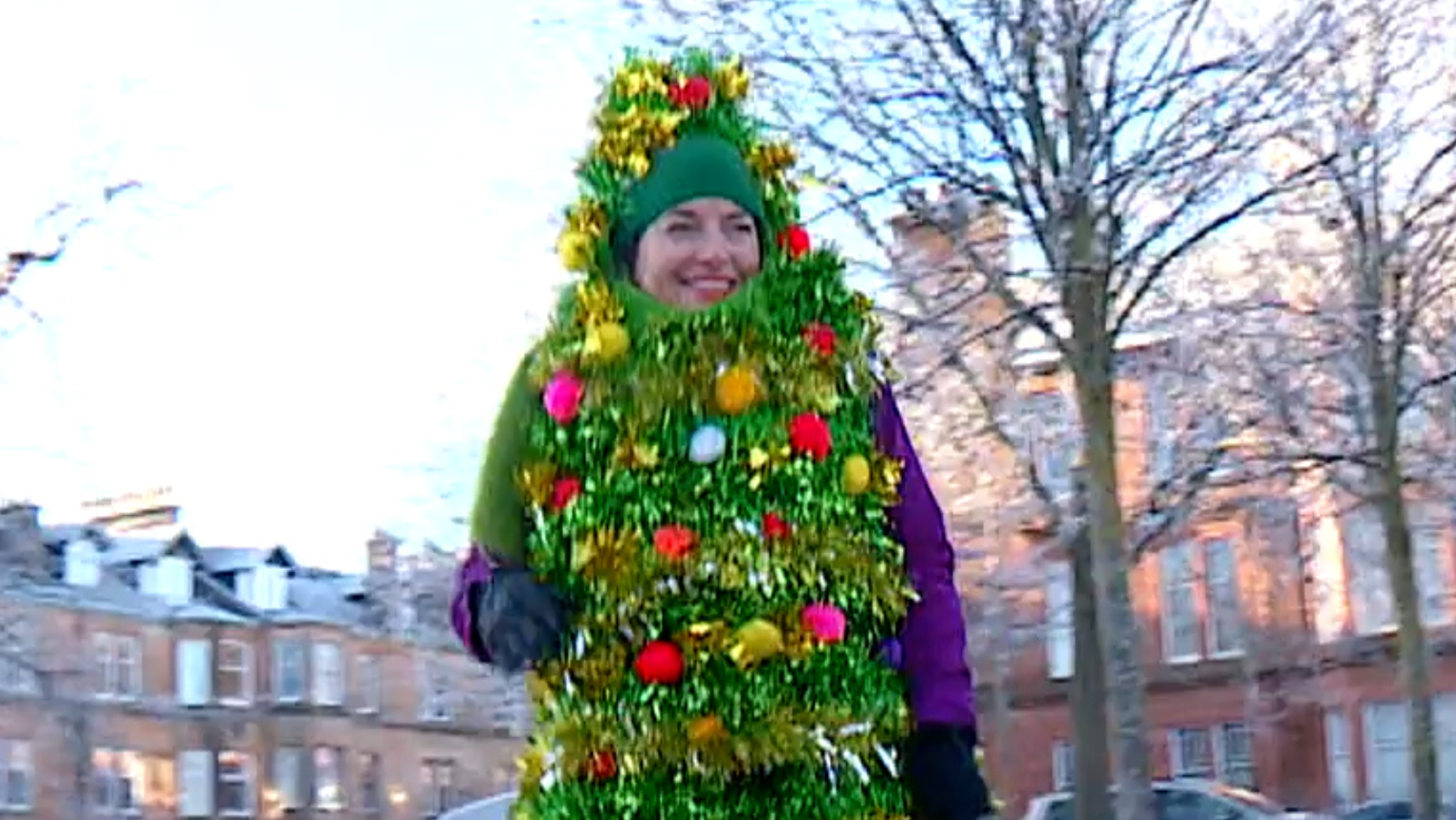 Activist dresses as Christmas tree and dances in Glasgow for 24 hours to raise funds for warm banks | STV News Activist dresses as Christmas tree and dances in Glasgow for 24 hours to raise funds for warm banks | STV News