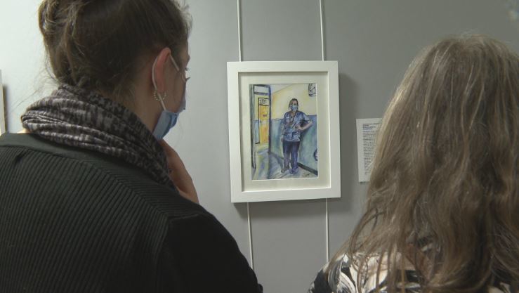 Charge nurse Cheryl Gill sees her portrait for the first time.