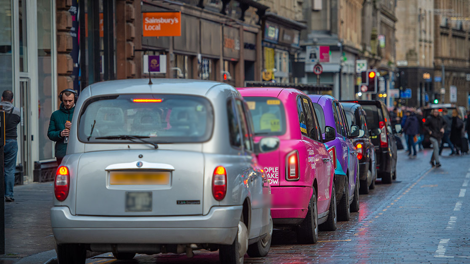Taxis waiting outside Glasgow Central railway station.
