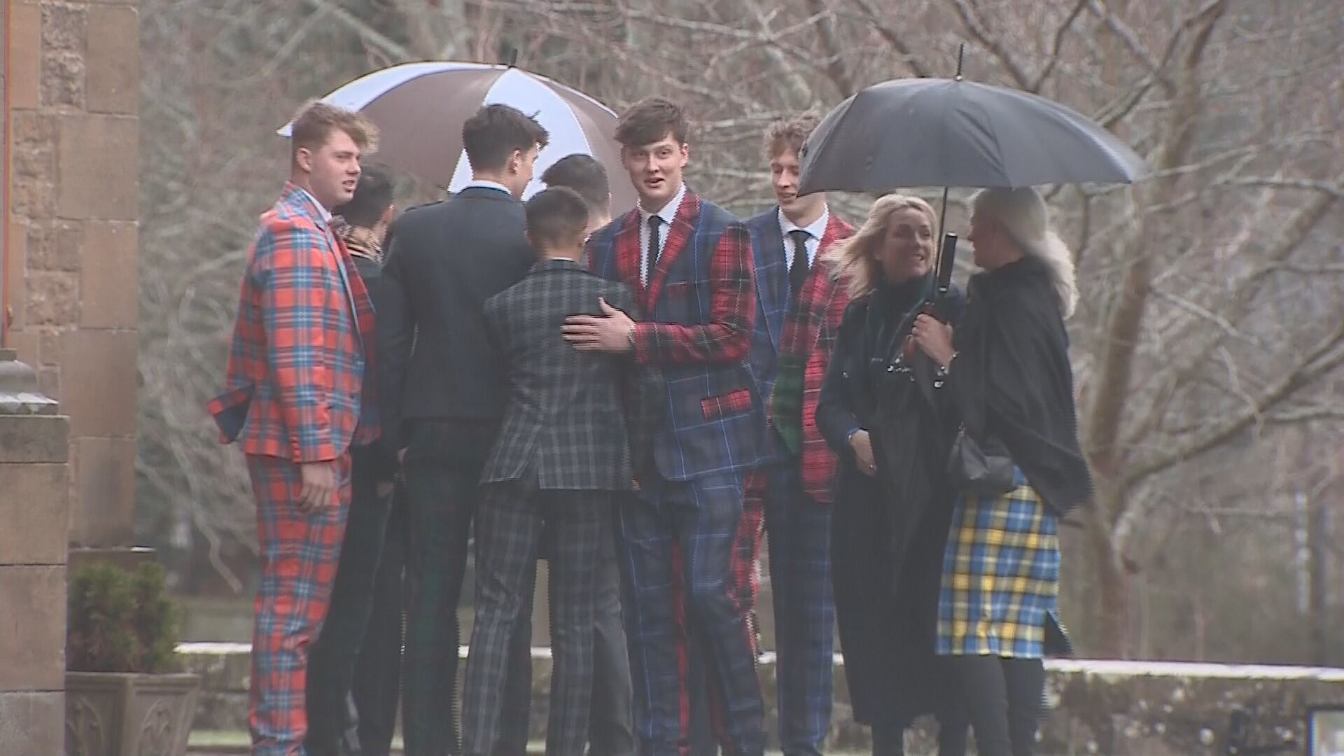 Friends and family arrived clad in tartan suits to pay tribute to the former rugby star.