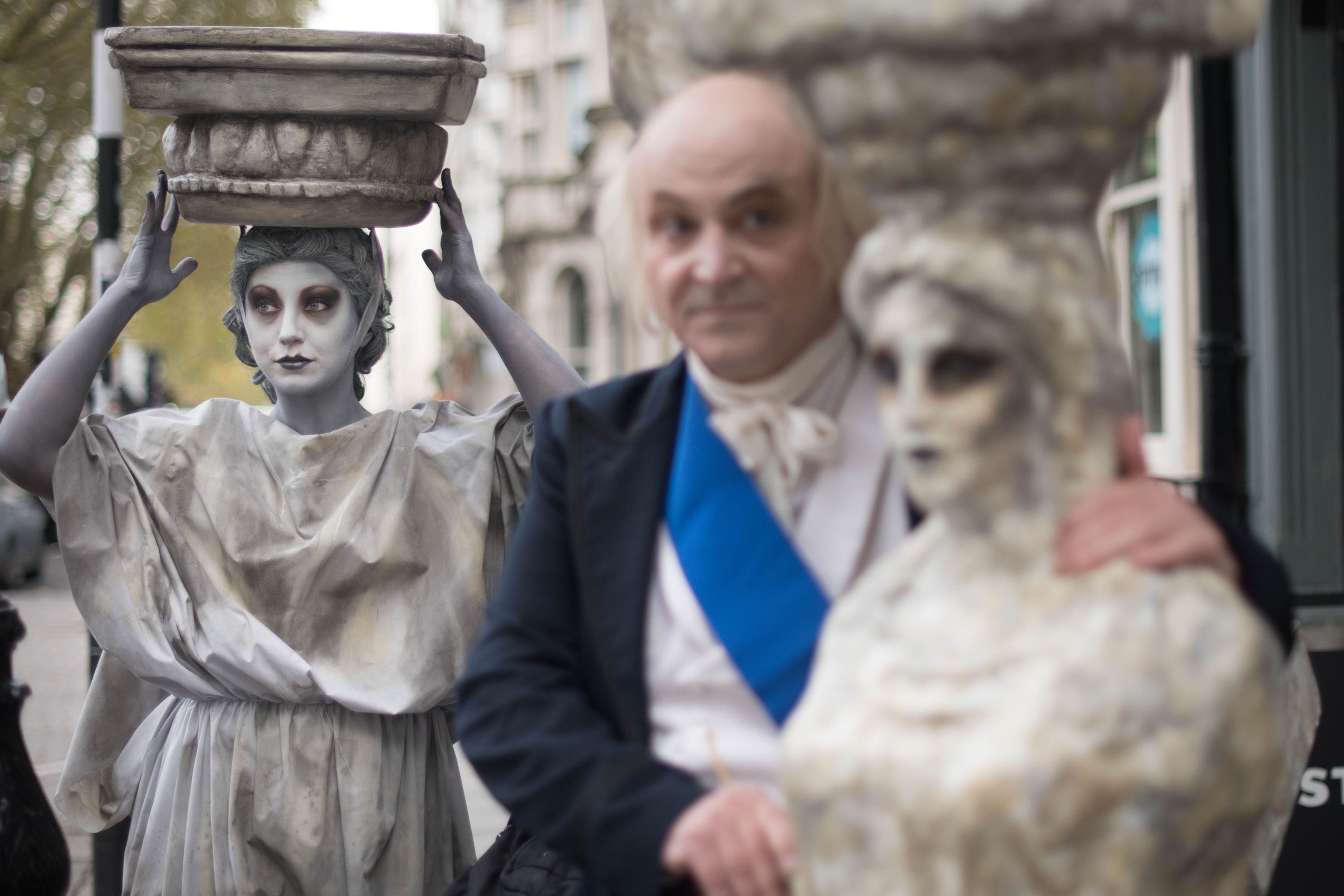 Campaigners dressed as Lord Elgin and a Parthenon Marble demonstrate outside the British Museum.