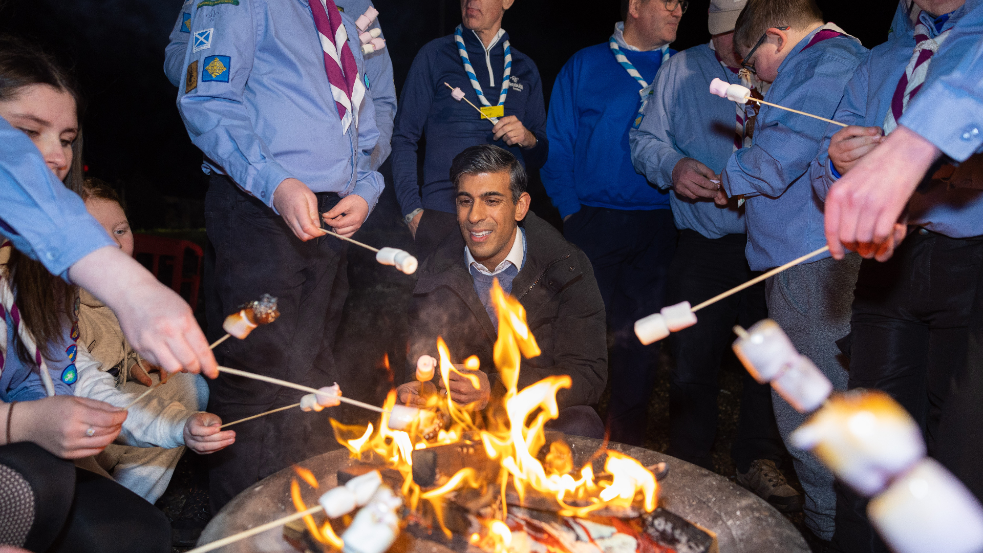 Prime Minister Rishi Sunak met a sea scout group in Inverness and toasted marshmallows with them over an open fire.