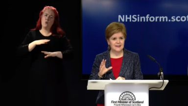 First Minister Nicola Sturgeon urges people to wear face masks as hospitals near capacity
