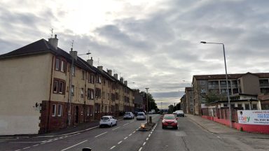 Two taken to hospital after home engulfed by fire by Main Road in Paisley