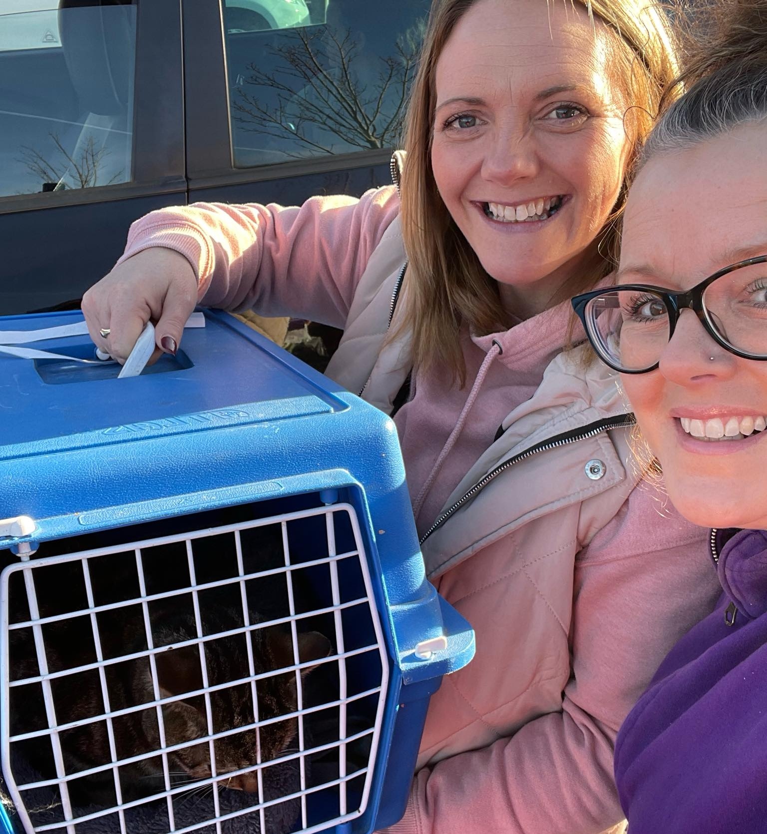 Pixie (left) was reunited with Katie (middle) on Friday, thanks to Andrea (right). 