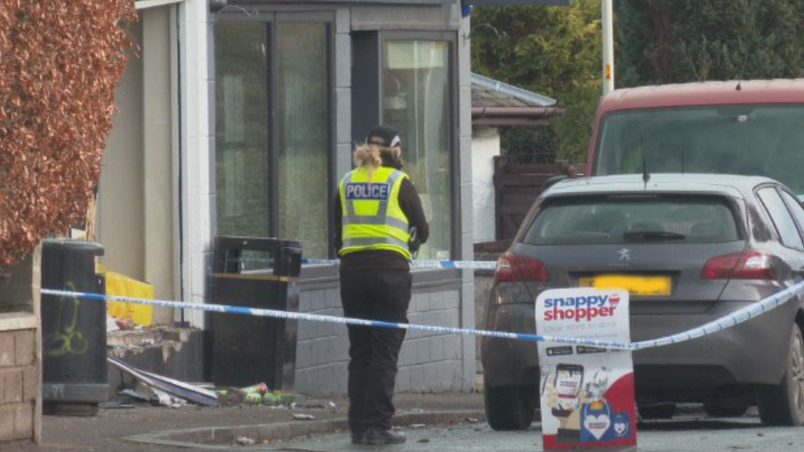 Police outside the shop following the crash in Broughty Ferry.