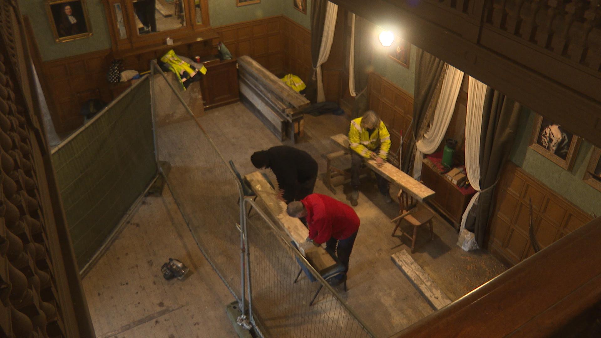 Volunteers making repairs on site at Bannockburn House.