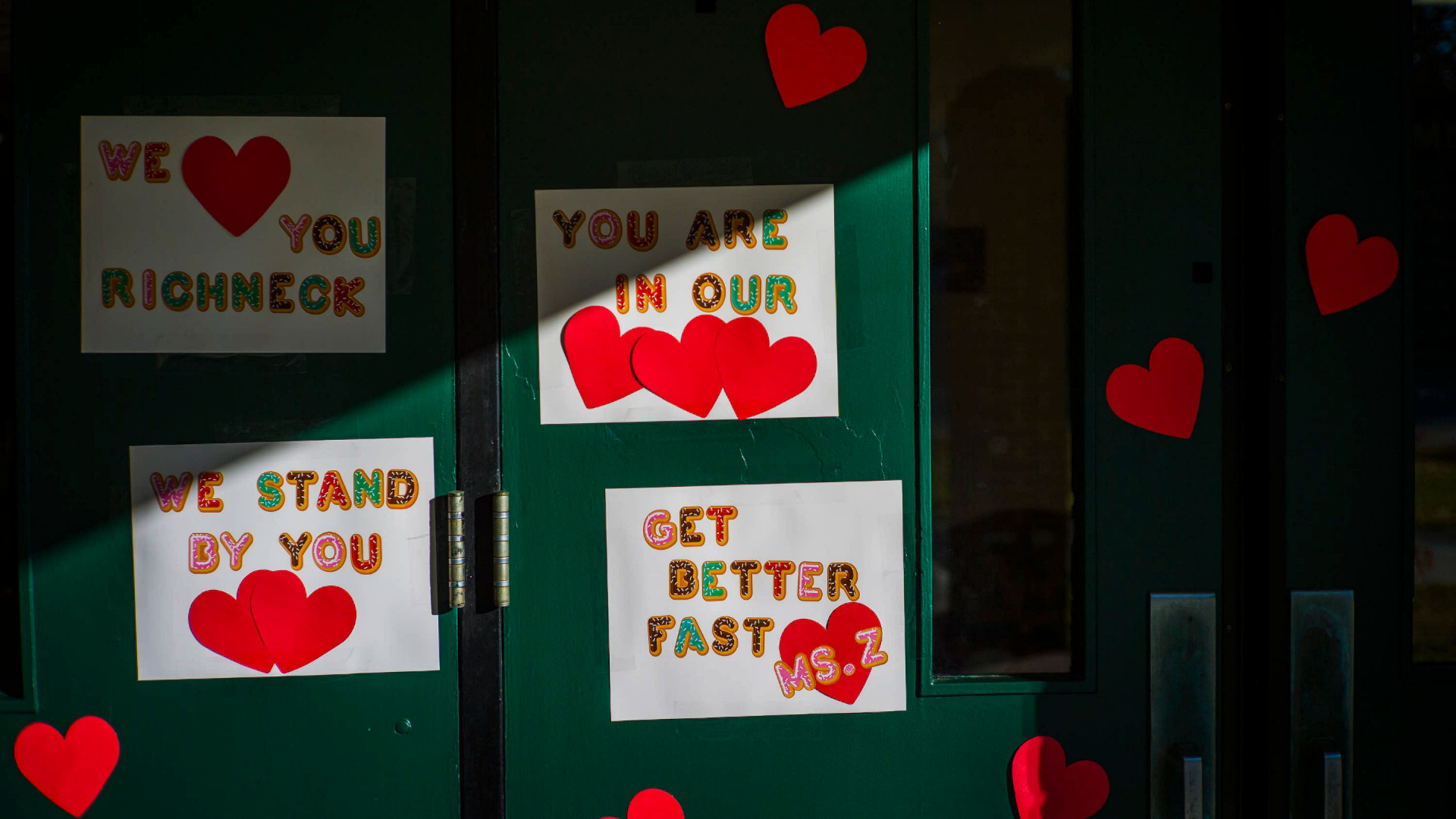 Messages of support for teacher Abby Zwerner gracing the front door of Richneck Elementary School.