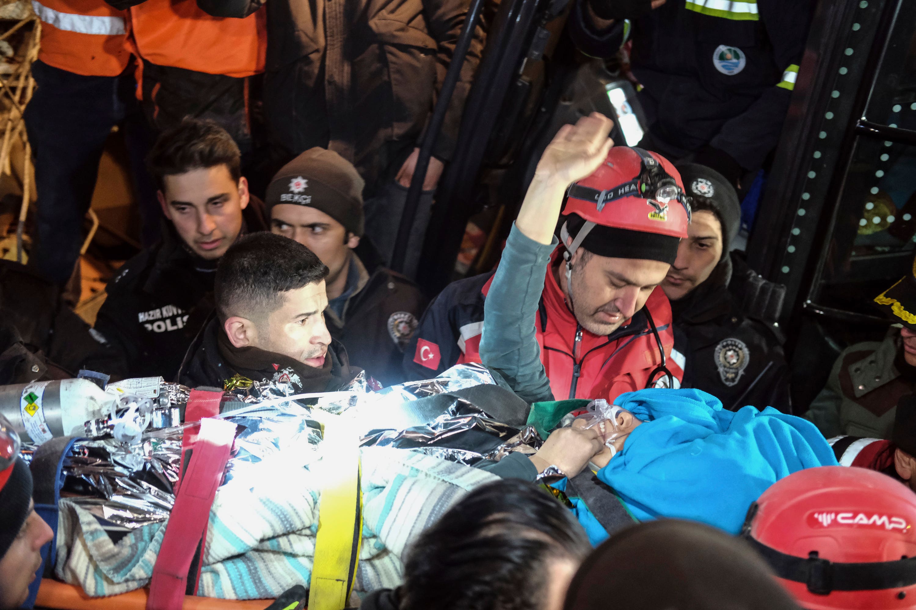 Rescuers surround Hatice after she was rescued 92 hours after Monday’s earthquake in Kahramanmaras.