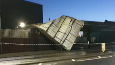 Arnold Clark roof blown off in Greenock after high winds as police lock down area