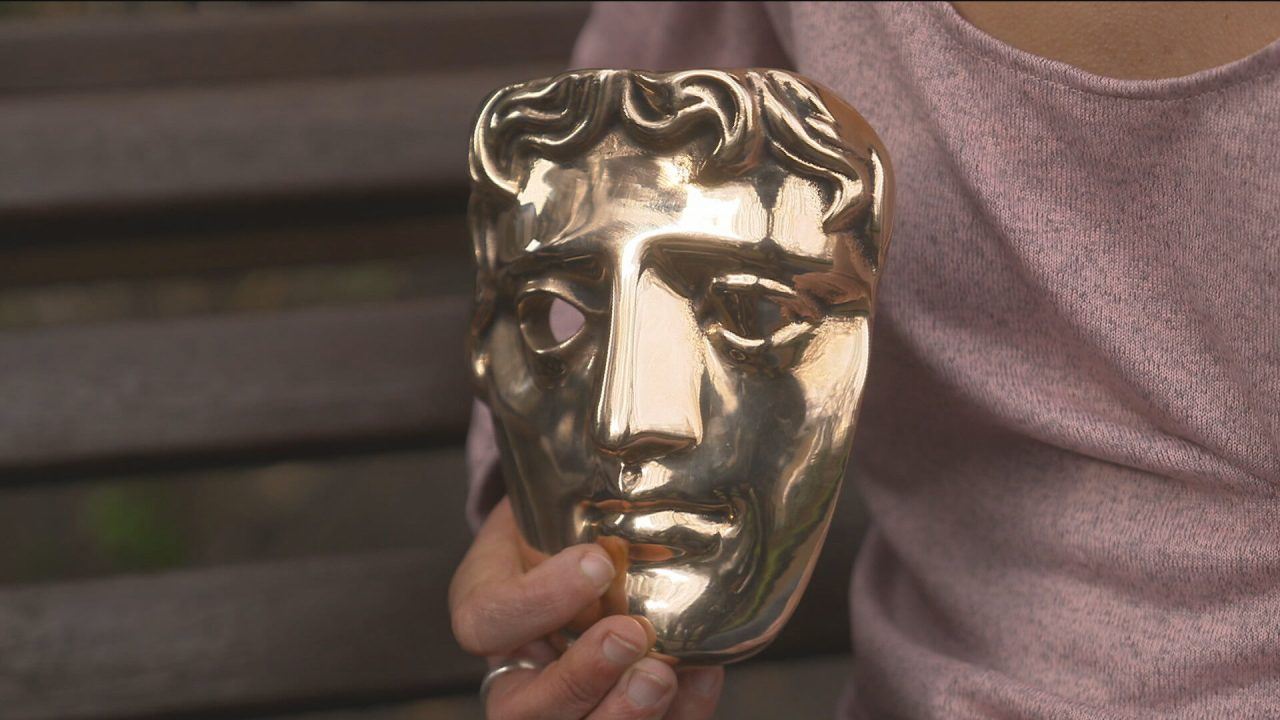BAFTA award is seen close up being held