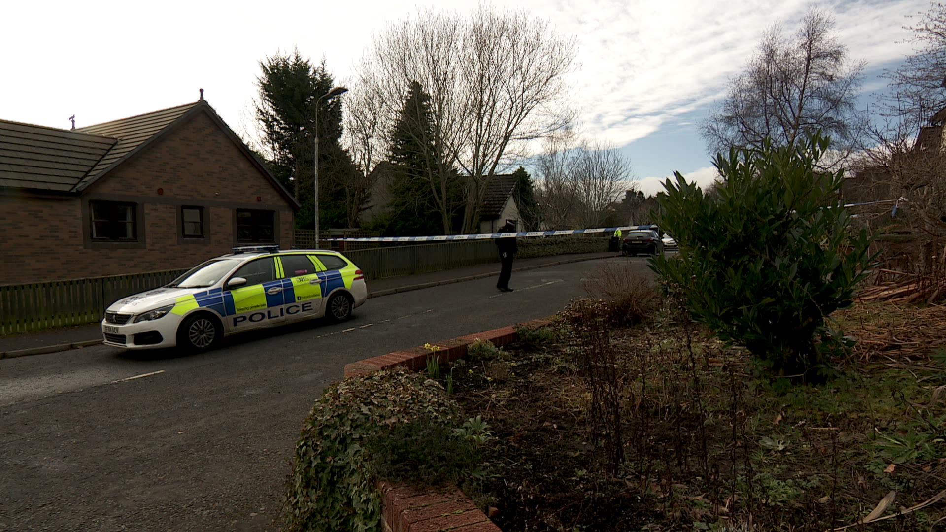 A police cordon was established around a home in Gattonside, a small village east of Galashiels town on the opposite side of the River Tweed to Melrose.