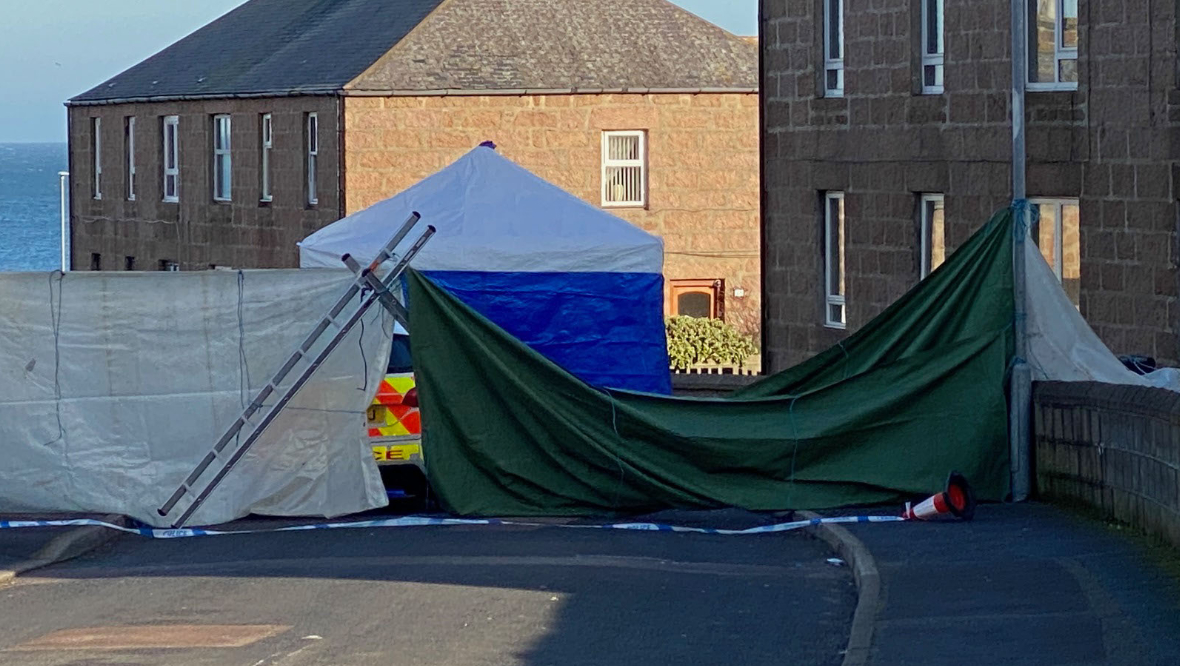 Police at the scene of the property in Peterhead.