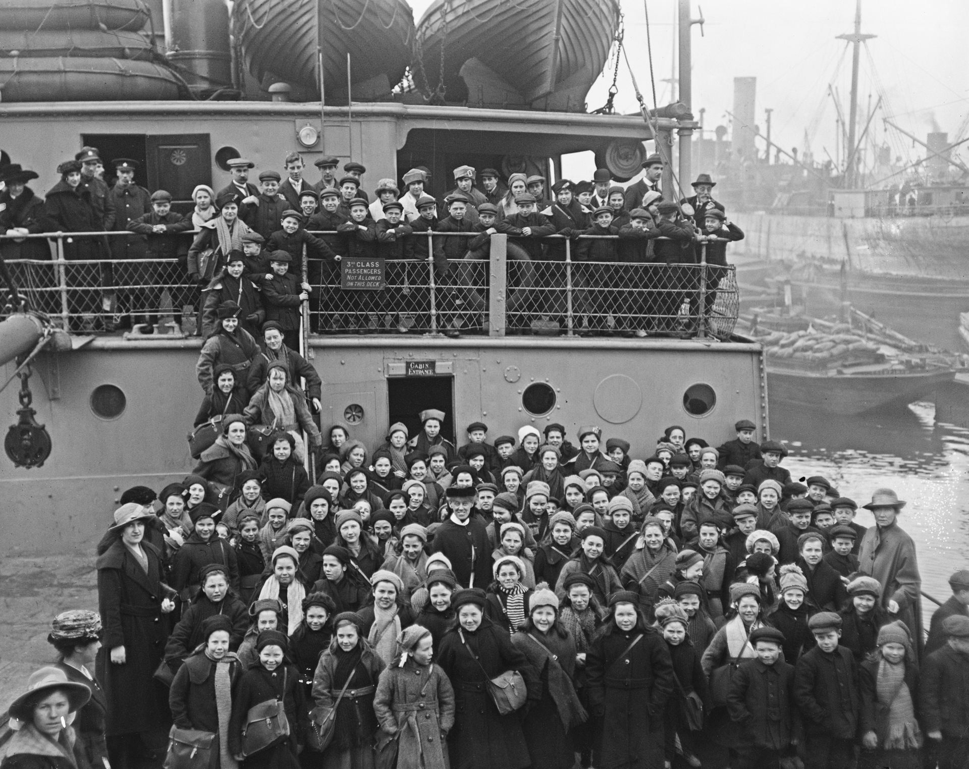 Children from Barnardo's homes for orphaned or destitute children, on board the SS Sicilian at Surrey Commercial Docks, London, before emigrating to Canada, March 11, 1920. They are the first party of Barnardo children to leave for Canada after World War I.