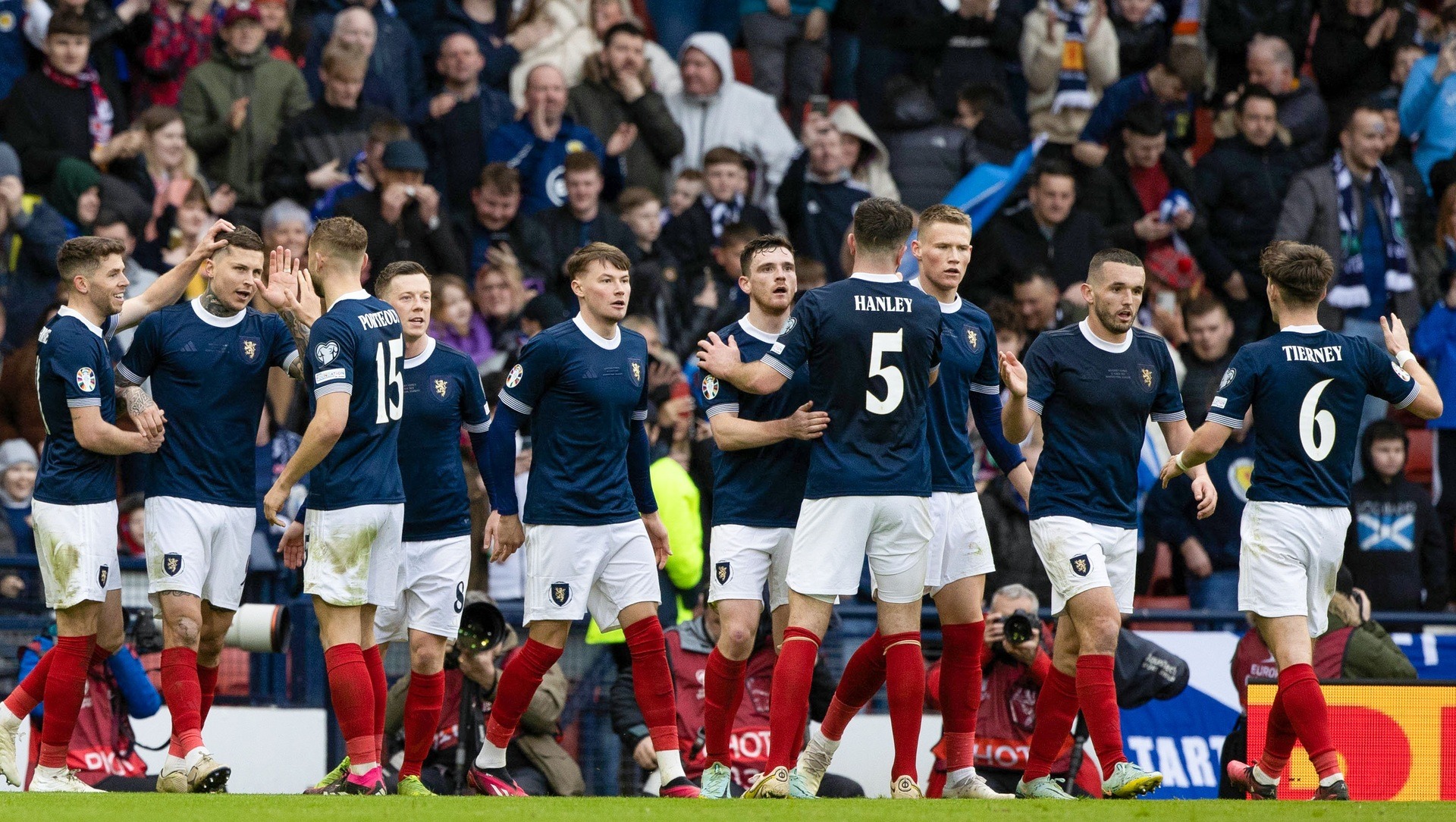 GLASGOW, SCOTLAND - MARCH 25: the Scotland players celebrate as Scott McTominay makes it 2-0 during a UEFA Euro 2024 Qualifier between Scotland and Cyprus at Hampden Park, on March 25, 2023, in Glasgow, Scotland. (Photo by Craig Williamson / SNS Group)