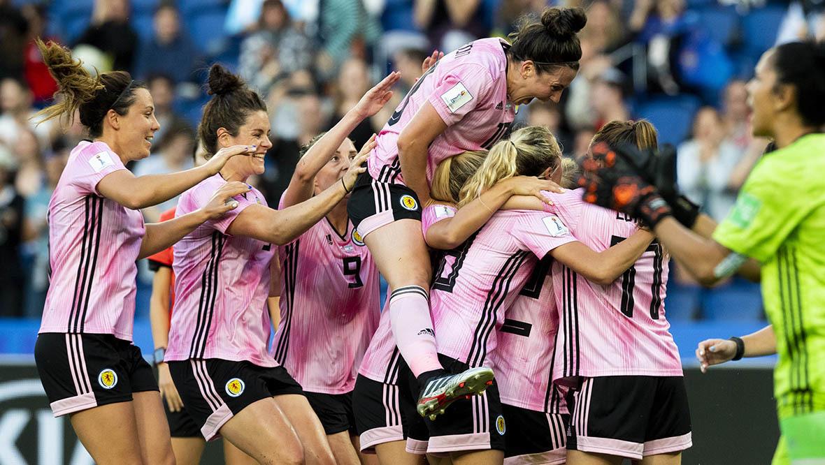 The Scotland players mob goalscorer Kim Little at the 2019 World Cup.