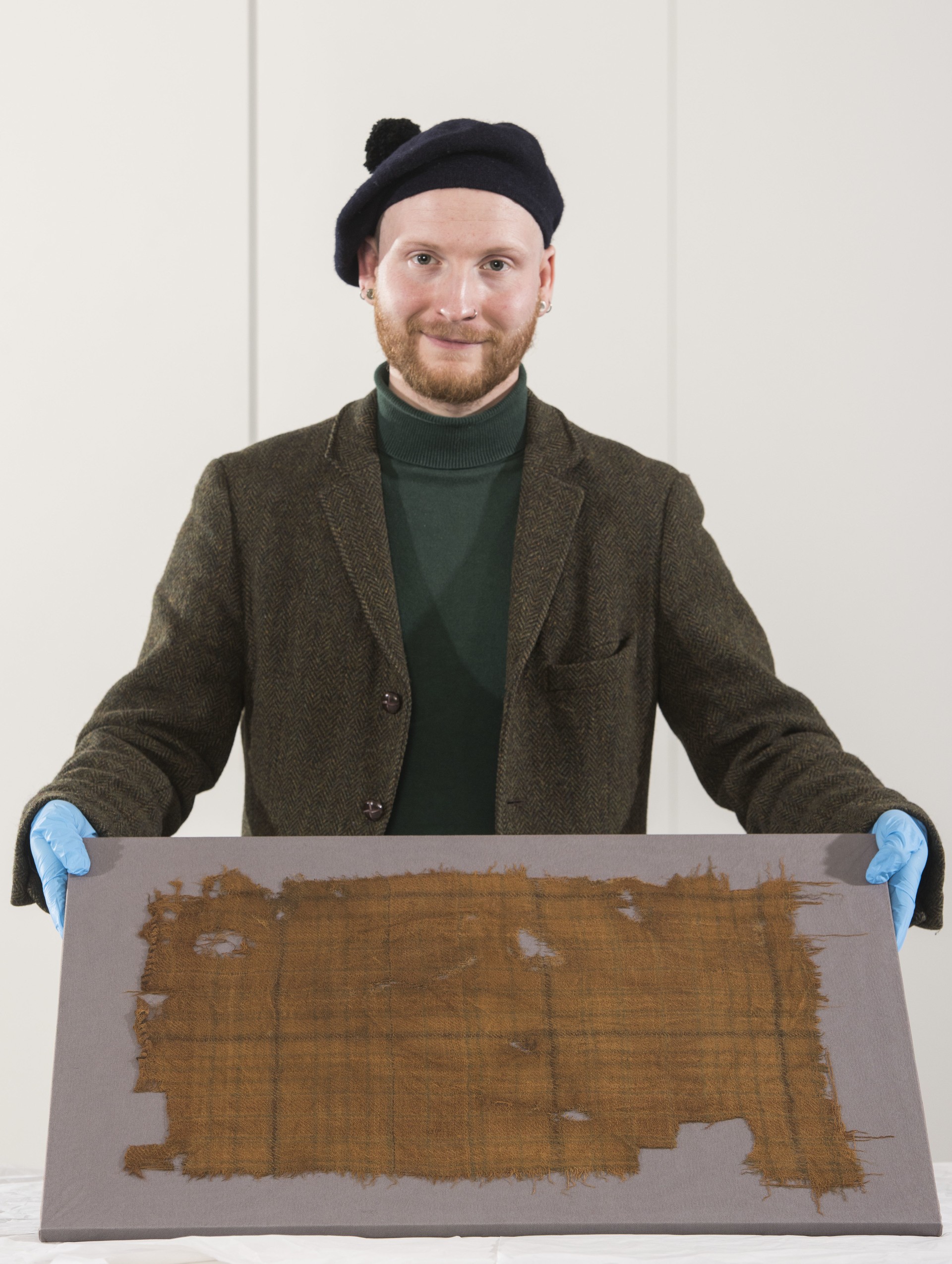 V&A Dundee curator James Wylie with the Glen Affric tartan.