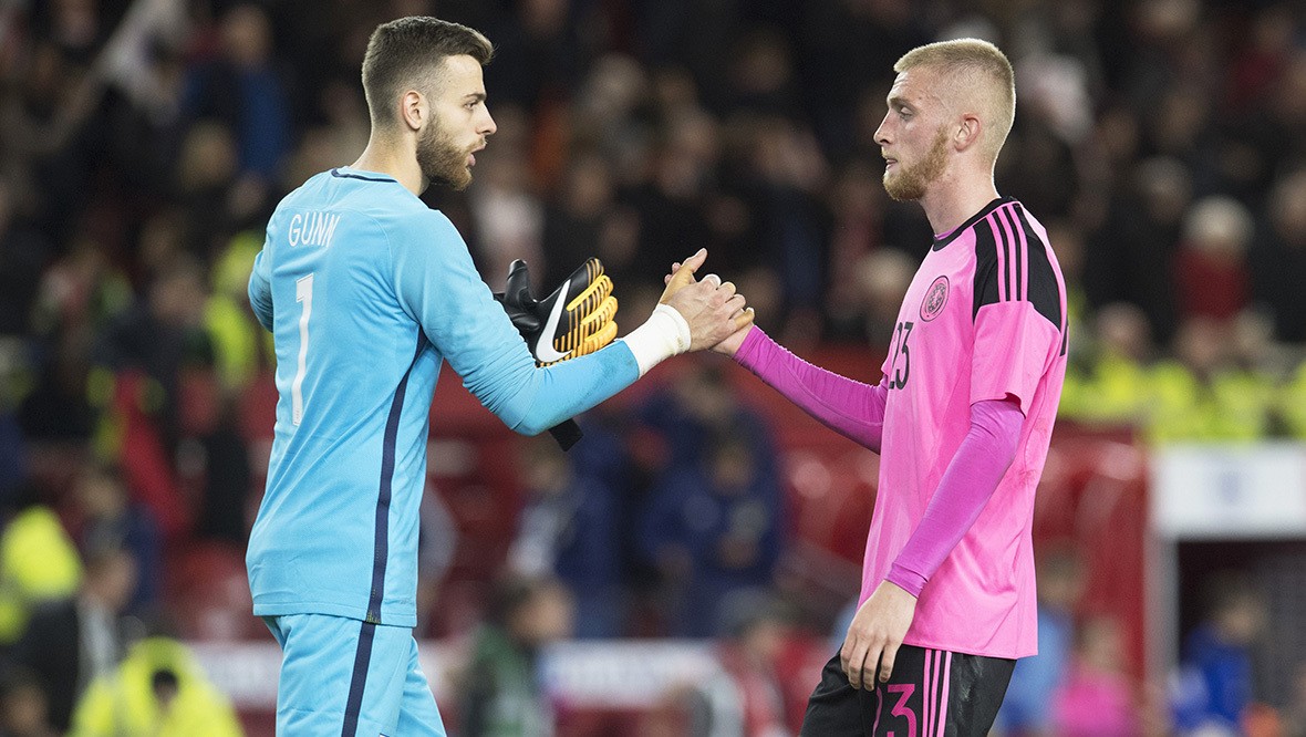 Angus Gunn, representing England, shakes hands with Oli McBurnie after U-21 clash in Middlesbrough.