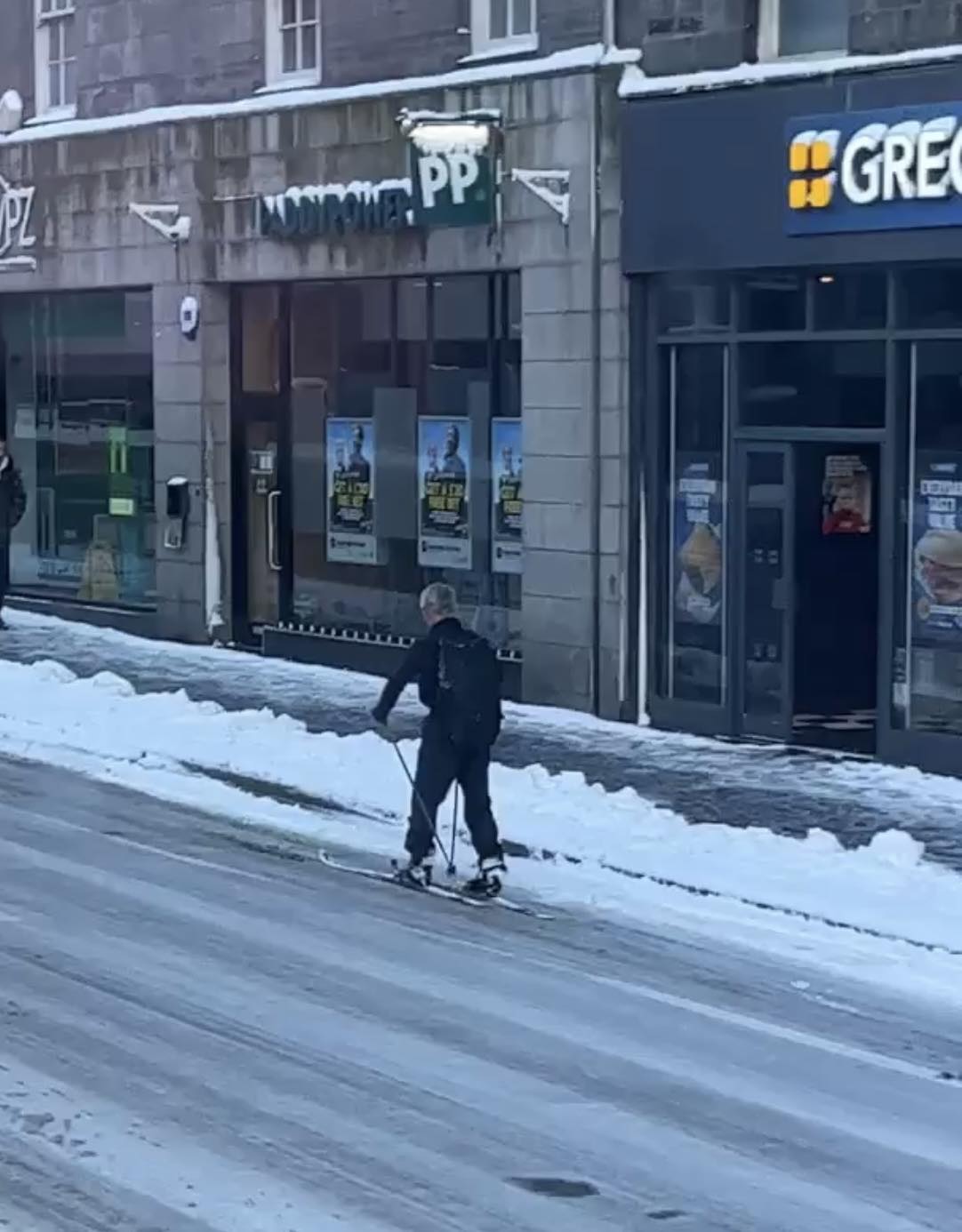 A commuter skis up Aberdeen's Union Street on Tuesday.