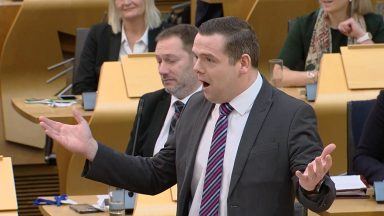 Douglas Ross sorry for swearing as protester disrupts questioning of Nicola Sturgeon at parliament